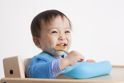 Cute baby with spoon